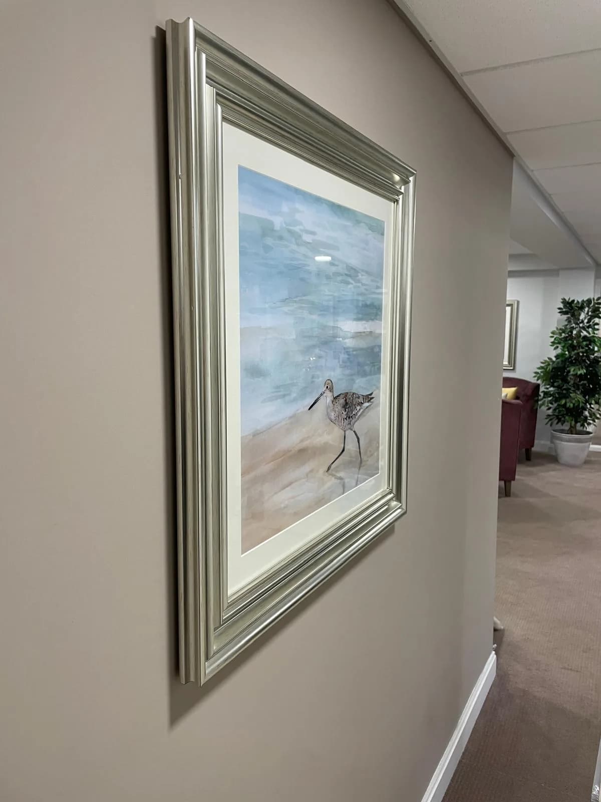 Freshly decorated communal corridor with framed artwork